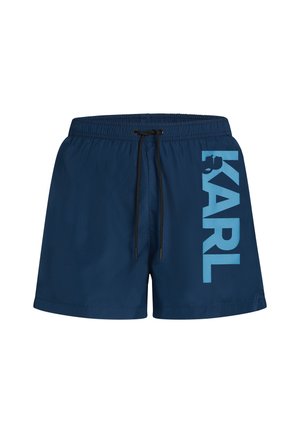 Shorts de bain bleu marine avec taille élastique et cordon de serrage. Présente un grand graphisme "KARL" en bleu clair sur le côté. Texture lisse, design décontracté.