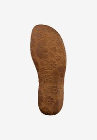 Brown rubber shoe sole featuring a floral pattern with raised flowers. Textured surface with grooves for grip. Brand name visible along the edge.