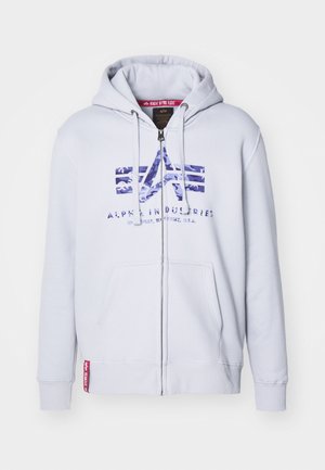 Lys grå zip-up hoodie med snor i hætten, med et blåt camo-logo på brystet og to forlommer. Tekstureret stof.