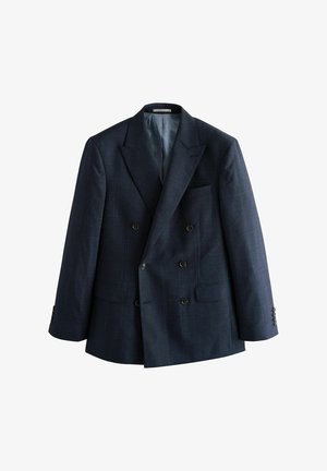 Blazer navy à double boutonnage en tissu texturé, avec revers en pointe, quatre boutons noirs et deux poches avant. Doublé en tissu léger.