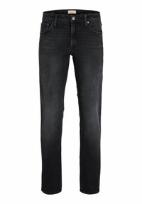 Jeans ajustados negros con cierre de botón y cremallera, cinco bolsillos y un ligero desgastado en los muslos y las rodillas.