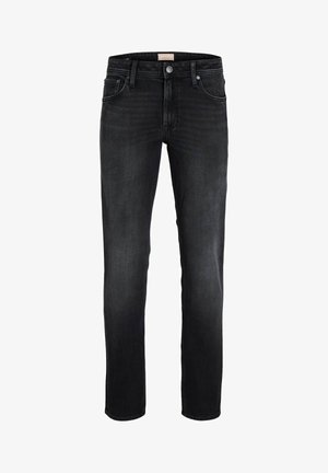 Melnas šauras piegriezuma džinsus ar pogu un rāvējslēdzēju, pieciem kabatām un smalku izbalēšanu uz augšstilbiem un ceļgaliem.