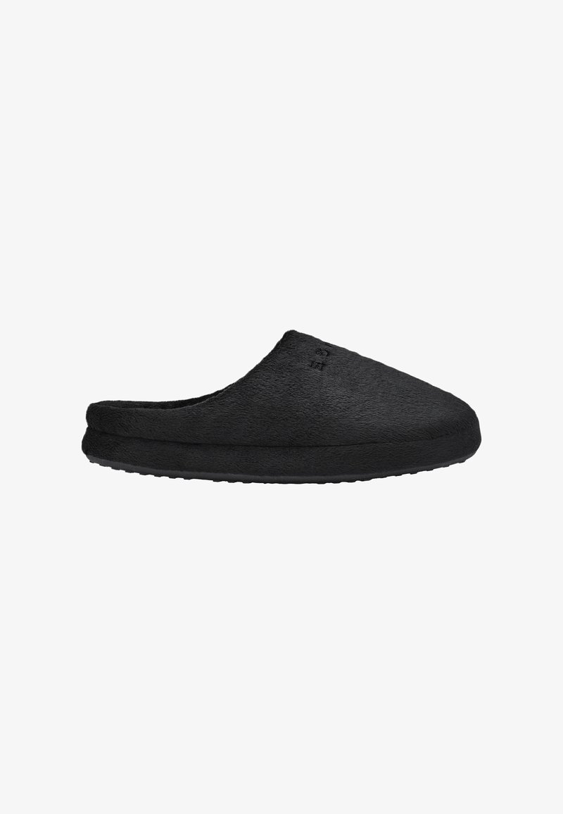 Chausson noir en tissu doux à enfiler avec bout fermé et semelle rembourrée, conçu pour le confort et la chaleur en intérieur.