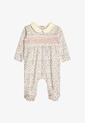 Salopetă cu imprimeu floral dintr-un material moale, având mâneci lungi, un guler alb și detalii plisate pe piept.