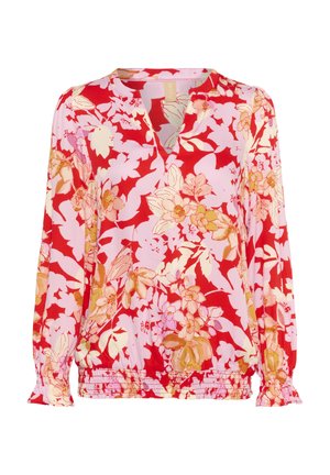 Lilleseel punase ja roosa värviga, kerge kangas, V-kaelus, pikad varrukad elastsete mansettidega, ruttu kogutud alläär, suurte lillemusterdega.