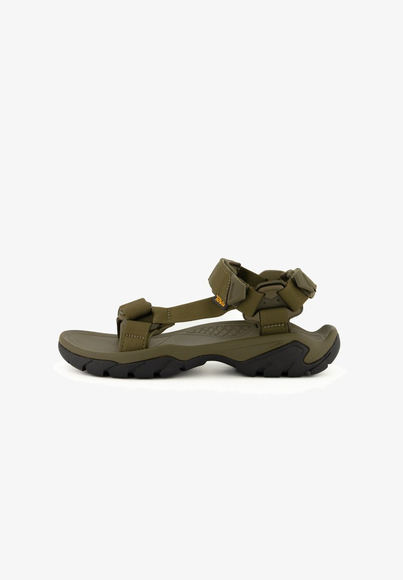 Sandalias deportivas color verde oliva con correas ajustables y suela texturizada. Presentan una suela exterior de goma negra duradera con un patrón en zigzag para mayor tracción.