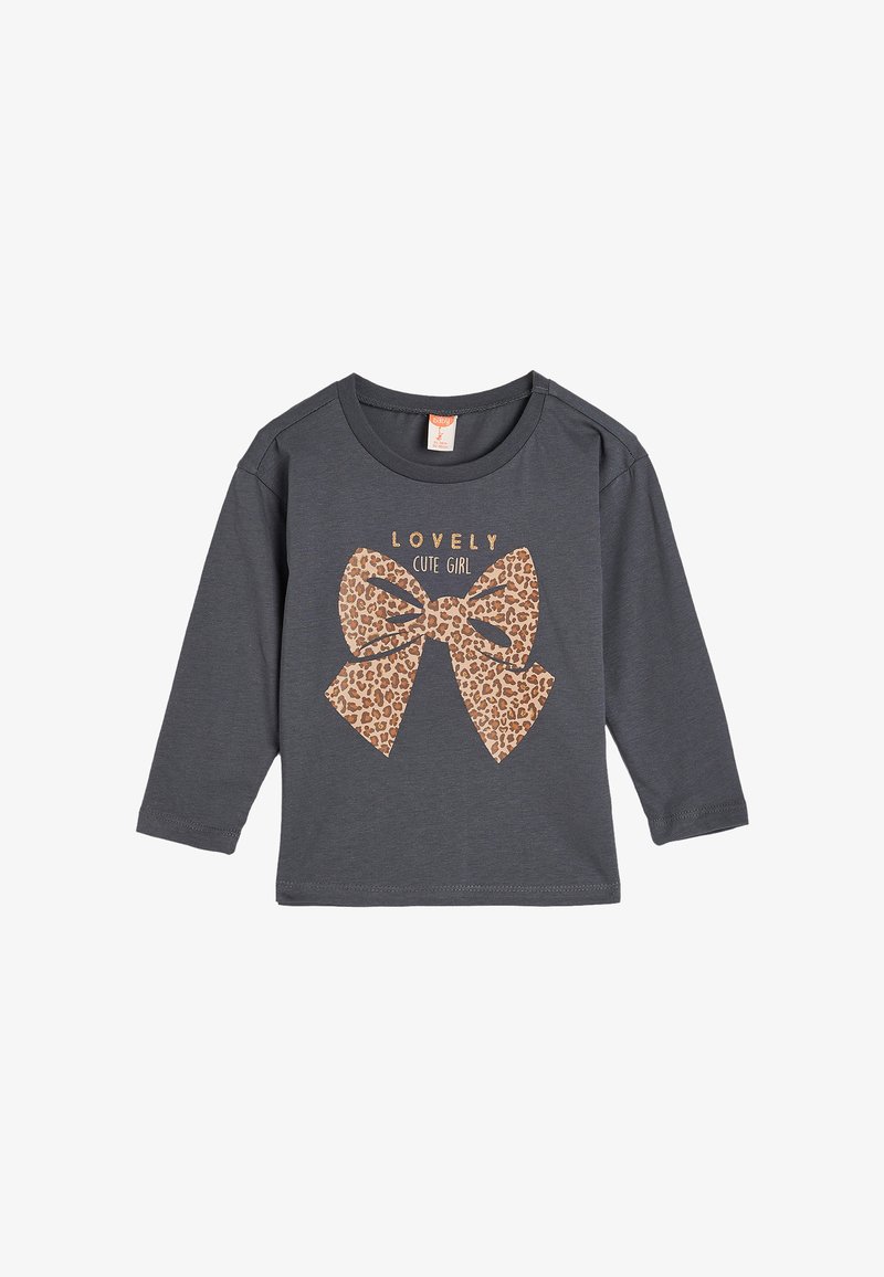 Gray long-sleeve shirt featuring a large leopard-print bow graphic with the text "LOVELY CUTE GIRL" in gold above the bow. Soft material.