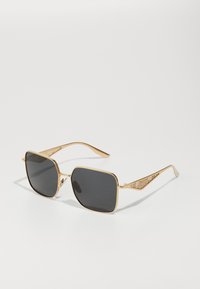 Seleccionado, gold-coloured