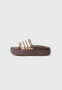 Brown slide sandal featuring a wide strap with a leopard print design. Rounded toe and textured sole for added grip.