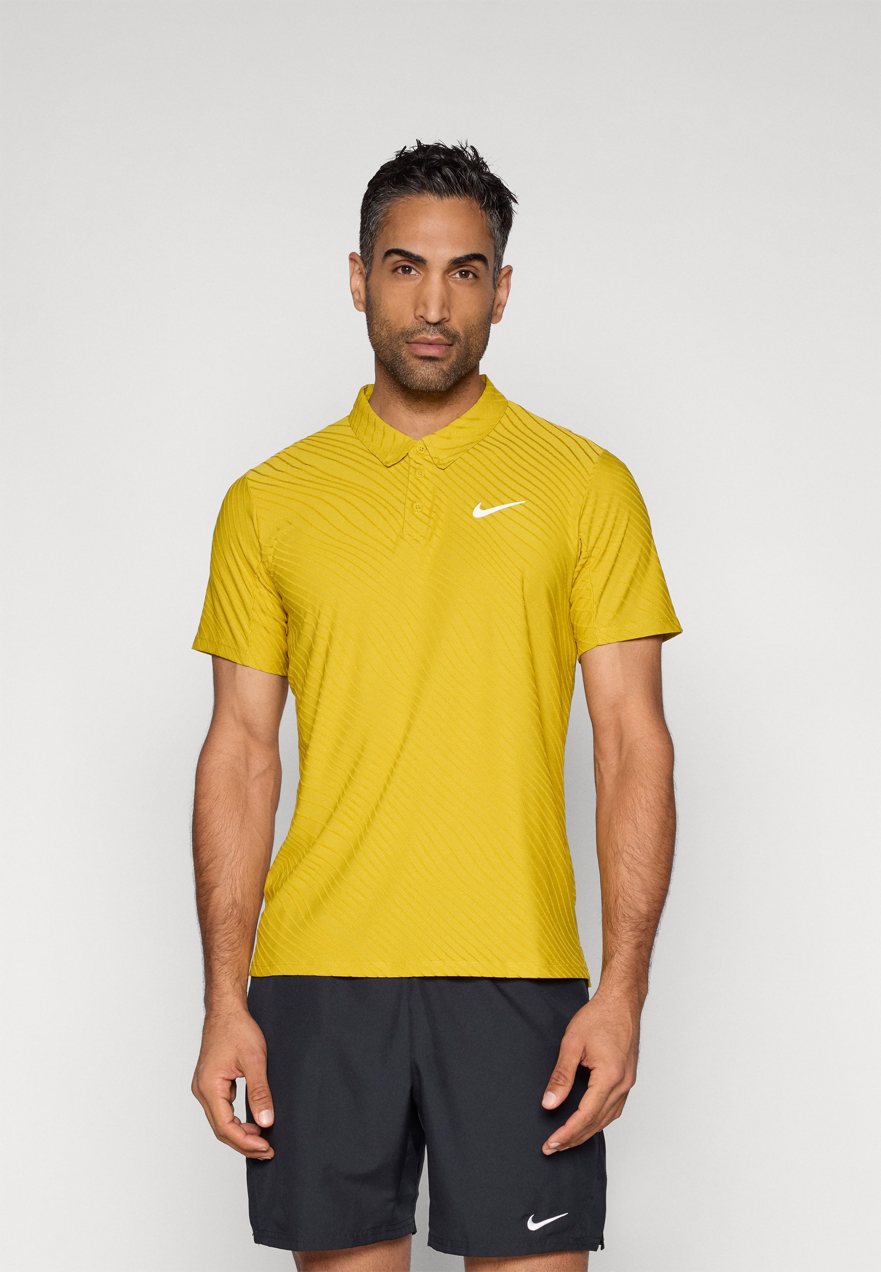yellow nike polo