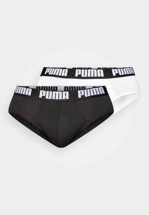 Bragas de mujer PUMA en negro y blanco, con una suave cinturilla elástica que presenta un logo repetido, tejido suave y una forma clásica de braga.
