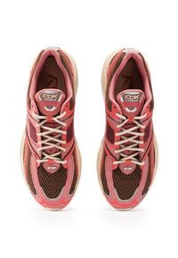 Sport shoes in red, brown, and beige. Mesh and synthetic upper, rounded toe, and lace closure. Features textured panel accents.