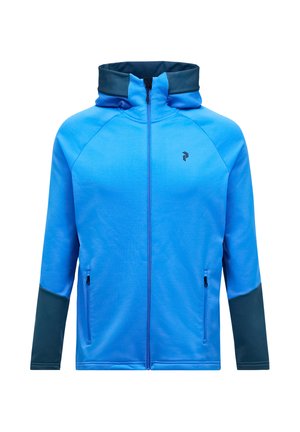 Blaues Zip-Hoodie mit hohem Kragen, kontrastierenden dunkelblauen Ärmeln, zwei seitlichen Reißverschlusstaschen und einem kleinen Logo auf der Brust.