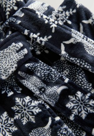 Tumesinine fliisist tekk, millel on valged jääkarud ja lumehelbed. Pehme tekstuur koos detailse looma- ja lumehelbe mustriga.