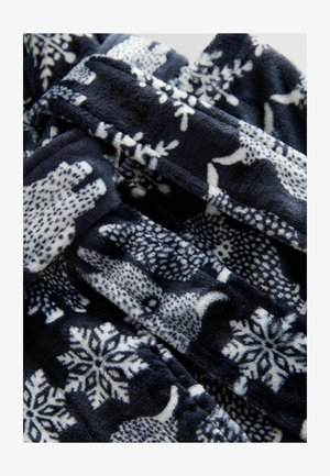 Tumesinine fliisist tekk, millel on valged jääkarud ja lumehelbed. Pehme tekstuur koos detailse looma- ja lumehelbe mustriga.