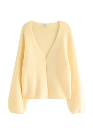 Gelber Strickcardigan mit tiefem V-Ausschnitt, breiten Ärmeln und einer weichen, strukturierten Oberfläche. Ohne Verschlüsse; tailliert und kurz geschnitten.