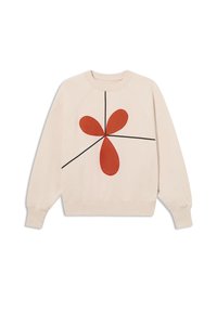 Sweatshirt crème avec un grand motif abstrait rouge comprenant des pétales arrondis et des lignes noires. Manches raglan, texture douce et ourlet côtelé.
