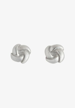 Une paire de petites boucles d'oreilles en argent, en forme de nœuds tordus, avec des surfaces lisses et polies.