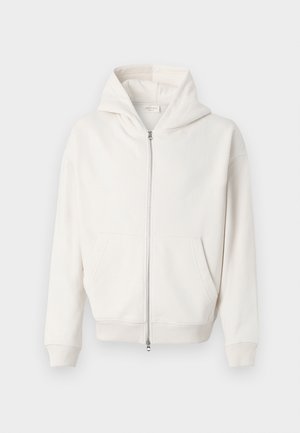 Crème-kleurige zip-up hoodie van zachte stof, met een grote capuchon, kangoeroe zakken en geribbelde manchetten en zoom.