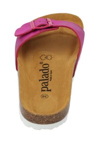 Rosa flip-flop sandal med en strukturerad korkfotbädd, justerbar rem och vit gummisula. Har "palado"-branding inuti.