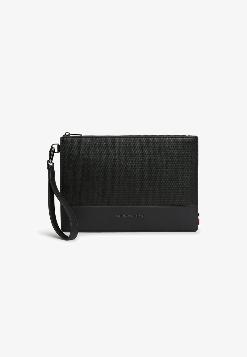 Black textured wristlet clutch with zipper closure, detachable strap, and "Tommy Hilfiger" logo on front lower section.