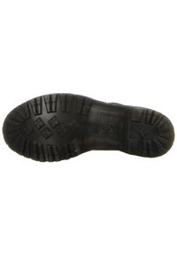 Semelle de botte noire avec des crampons profonds et des motifs conçus pour l'adhérence, présentant le logo de la marque et les indications de taille sur un fond blanc.