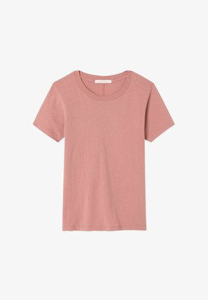 Svetlo ružové tričko s krátkym rukávom vyrobené z mäkkej bavlny. Má okrúhly výstrih a voľný strih. Bez viditeľných vzorov či ozdôb.
