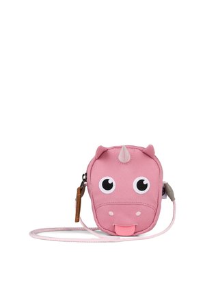 Kleine pinke Umhängetasche in Form eines lächelnden Nashorn-Gesichts mit großen Augen, einem Horn, Ohren und herausgestreckter Zunge.