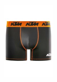 Boxer noir avec une ceinture élastique orange arborant le logo KTM. Les coutures sont orange, et un logo KTM blanc est présent à l'avant.