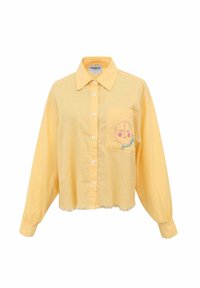 Chemise boutonnée jaune avec une poche dotée d'une broderie de soleil rose, ourlet effiloché et manches longues. Tissu doux avec une coupe décontractée.