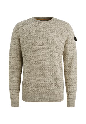 Beżowy sweter z dzianiny o fakturowanym wzorze, okrągły dekolt i ściągacze. Posiada małe logo akcentujące na lewym rękawie.