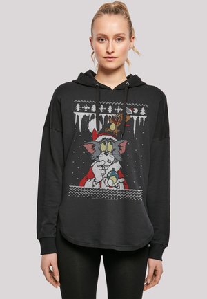 Black hoodie featuring a colorful festive graphic of a cartoon cat in a Santa outfit, with snowflakes and a Christmas design.