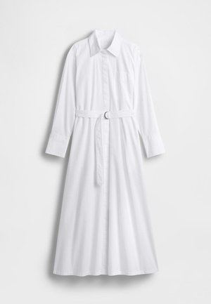 Fehér, hosszú ujjú ingruha galléros nyakkivágással, gombos elejű, derékpánttal és egyetlen mellzsebbel. Sima anyagtextúra.