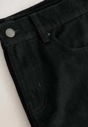 Black denim jeans with a classic five-pocket design. Features silver hardware, contrasting stitching, and a smooth texture.