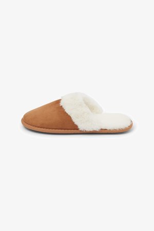 Brown suede slipper with white faux fur lining, rounded toe, and flat sole. Features a minimal design and soft texture.