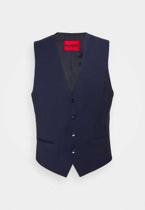 Chaleco azul marino sin mangas con cuatro botones negros y dos bolsillos laterales, con una etiqueta interior roja con texto "HUGO".