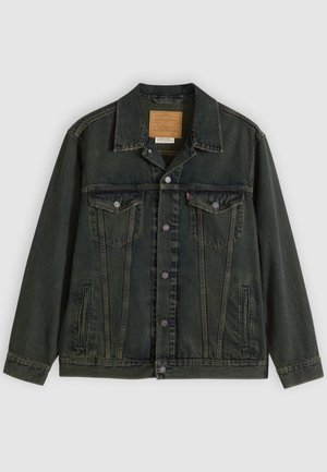 Dark green denim jacket featuring a classic cut, two chest pockets, metal buttons, and a patch label on the inner collar.