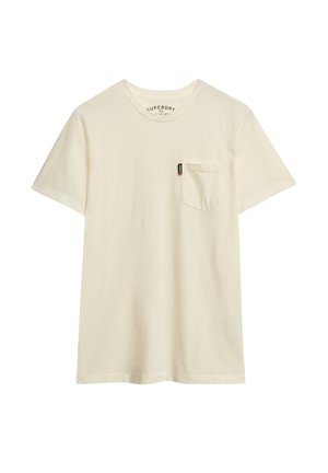T-shirt a maniche corte e colletto rotondo realizzato in cotone color crema chiaro, con una tasca sul petto sinistro e un piccolo etichetta del marchio sulla tasca.