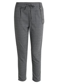 Grå rutiga byxor med dragsko i midjan, sidfickor och kedjedetalj på högra sidan. Lätt vävt tyg.