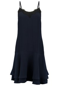 Marinblå ärmlös klänning med spetskant vid halsringningen och en utsvängd volangslått. Tillverkad av slätt tyg, med justerbara axelremmar.