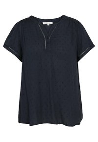 Blouse bleu marine à manches courtes avec col en V, patte de boutonnage, motif à pois texturé et délicates bordures ajourées aux manches et à l'encolure.