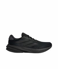 Scarpe da ginnastica nere con una parte superiore in mesh testurizzato, lacci piatti e design a tre strisce. Suola in gomma con una leggera elevazione del tacco.