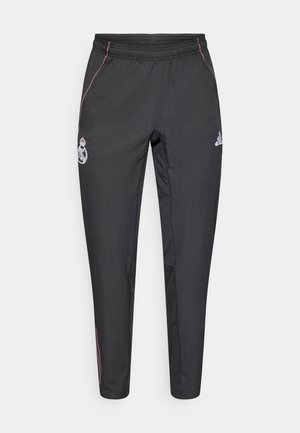 Schwarze Sporthose mit schmaler Passform, mit pinken Seitenstreifen und einem Logo. Hergestellt aus leichtem, strukturiertem Stoff, mit elastischem Bund.