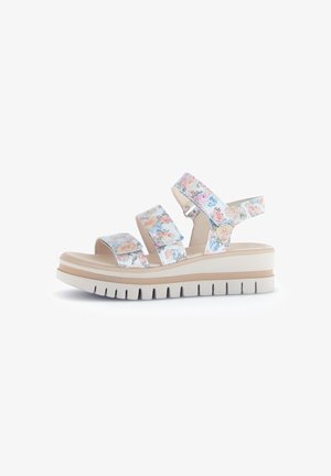Floral-patterned slide sandals featuring three adjustable straps, a cushioned footbed, and a thick white platform sole with textured grooves.