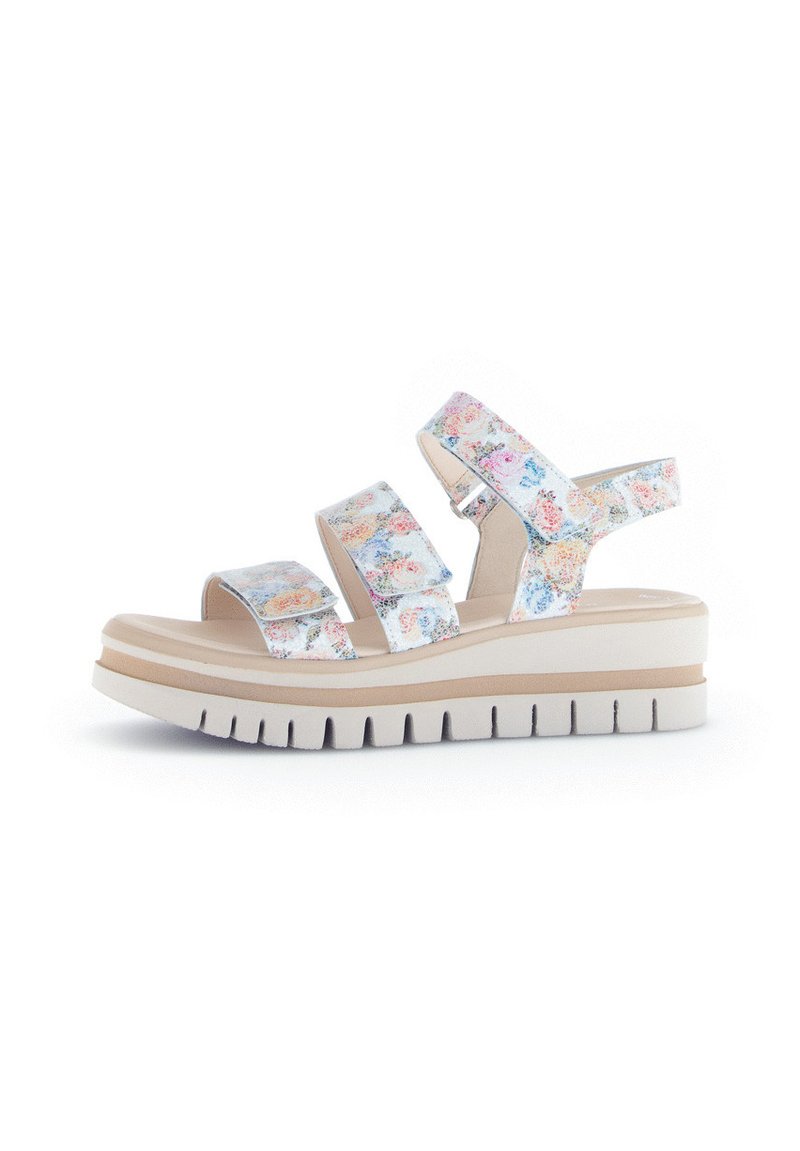 Floral-patterned slide sandals featuring three adjustable straps, a cushioned footbed, and a thick white platform sole with textured grooves.