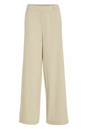 Bredde bukser i let beige stof, med elastisk talje og frynser foran, glat tekstur uden synlige mønstre eller hardware.