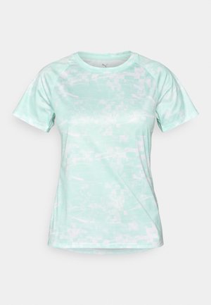 Mündroheline lühikeste käistega spordipait, millel on pikselitetaoline muster, valmistatud kergest ja hingavast kangast ning lahtise kaelusega.