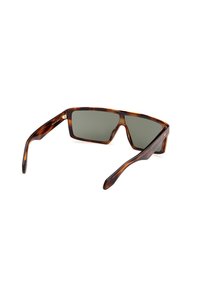 Tortoiseshell sunglasses with square lenses and grey tint. Plastic frame with smooth texture. Features metal accents on the hinges.