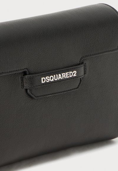 Black leather bag with a smooth texture, featuring a silver "DSQUARED2" logo on a small leather tab. Rectangular shape with rounded edges.