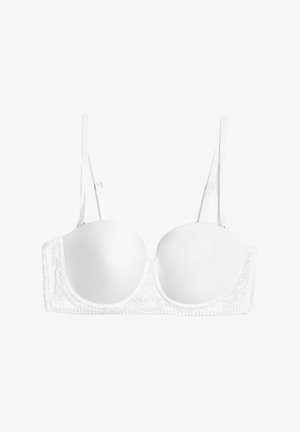 Reggiseno bianco in pizzo con coppe sagomate, spalline regolabili e un elastico testurizzato con dettagli in pizzo intricati lungo i lati.